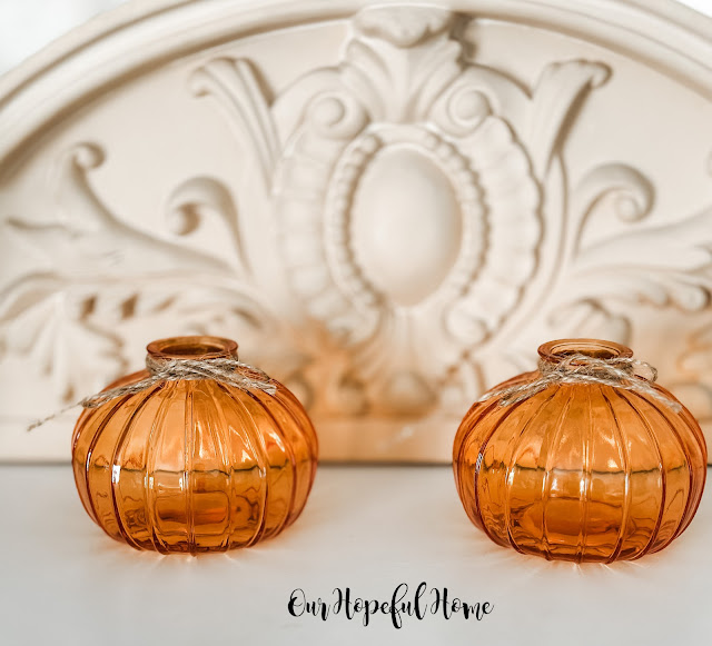 two orange glass pumpkin vases