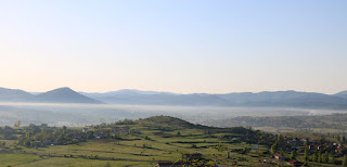 A line of smoke or mist across the valley