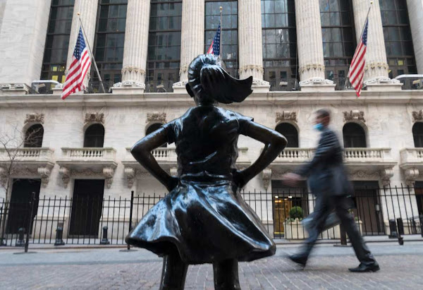 people walk past the new york stock exchange on wall street the benchmark sp 500 index rose to an all time high on wednesday photo afp