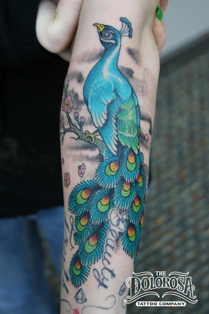 This peacock tattoo went on a pregnant stripper