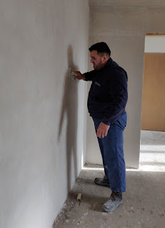 Halil sanding down the walls