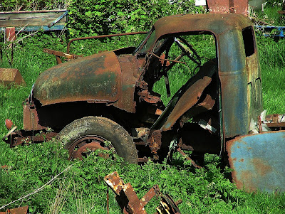 After photographing a pair of rusty cast iron gravestones in a 