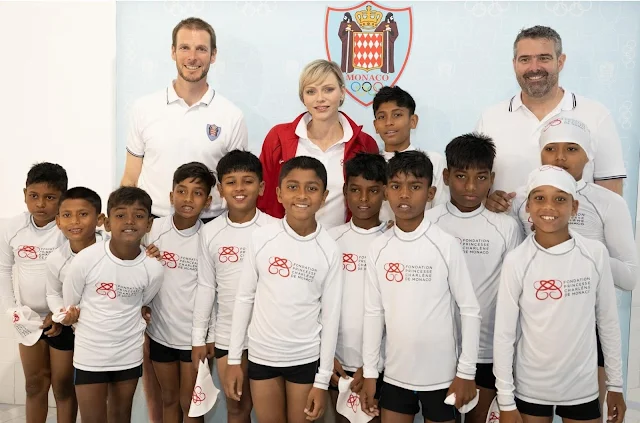 Sainte Devote Rugby Tournament. Princess Charlene of Monaco wore a red track jacket by Nike, and camel pants