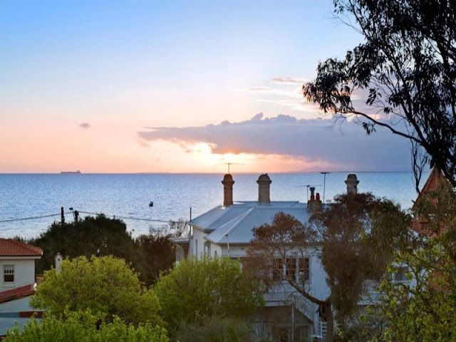 Photo of the sunset over the ocean as seen from the house