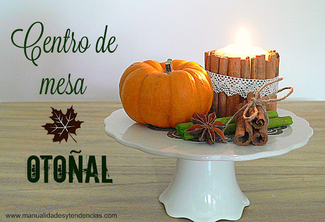 Centro de mesa hecho con calabazas, canela y vela