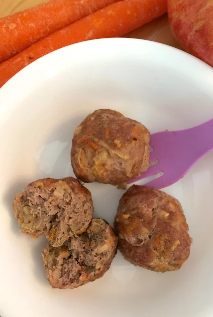 Close-up of toddler turkey, carrot, and apple meatballs.