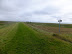 The OS map indicates the path straight ahead is not public, but the sign suggests otherwise
