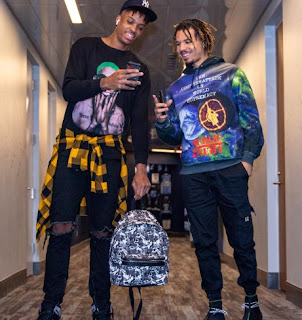 Armando Bacot posing for a picture with his friend
