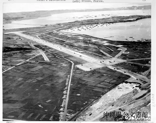 Awase Airstrip receiving its finishing touches from rollers and scrapers of the 36th Navy Construction Battalion.