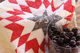 Antique doll quilt with cherries