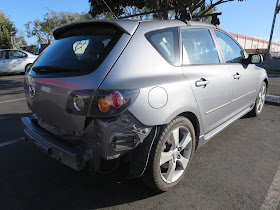 Collision damage from traffic accident before body repairs & paint at Almost Everything Auto Body