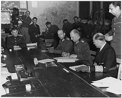 General Alfred Jodl signing the capitulation papers in Rheims.