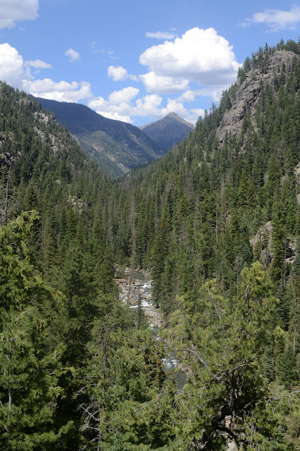 creek, canyon, and peaks beyond