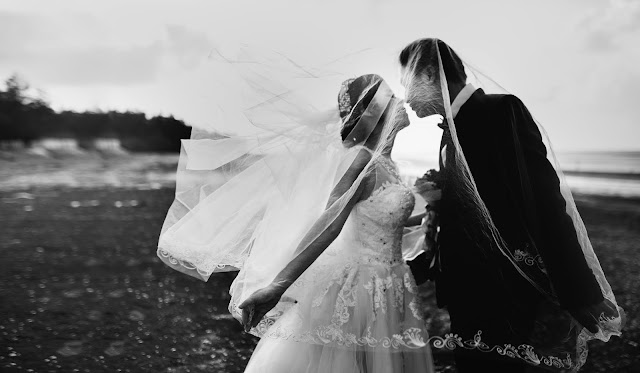 Wedding photo of man and woman kissing. Who should marry?