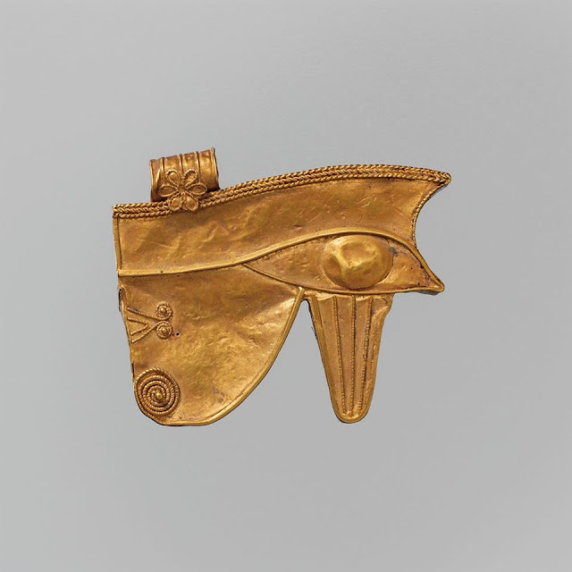 Golden wedjat-eye amulet. 