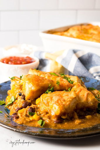 Chicken Enchilada Casserole with Biscuits on a dark plate.