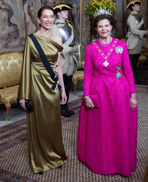 Queen Silvia wore a Padme pink gown by Georg et Arend. Princess Victoria wore a feather cape gown by Toteme