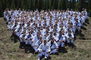 Students at a Colorado martial arts convention sitting in formation