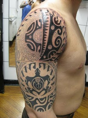 Big tribal tattoo on man strong Big tribal tattoo on man strong