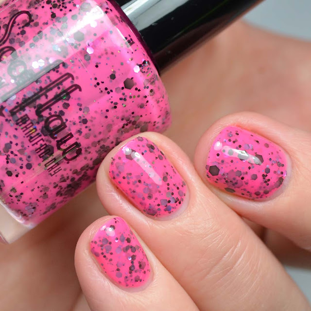neon pink nail polish with glitter swatch