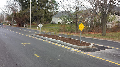 new traffic calming island on Oak St