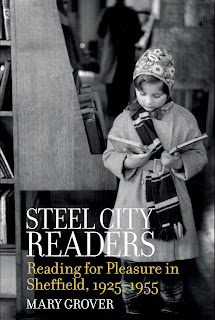 The cover of Steel City by Mary Grover features a photograph of a young girl in a library, selecting some books to read