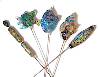 Handmade lampwork glass stick pins from Isinglass Design https://www.etsy.com/shop/glassbead?ref=seller-platform-mcnav&section_id=18945880