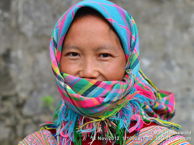 people, street portrait, headshot, face, eyes, headscarf, face bandana, Vietnam, Can Cau market, market woman, hill tribe, Flower H'mong, eye contact