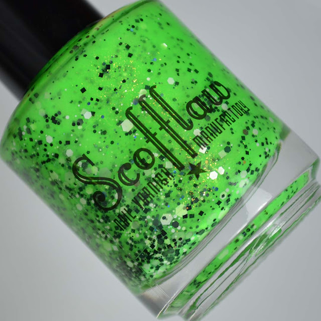 neon green nail polish with glitter in a bottle