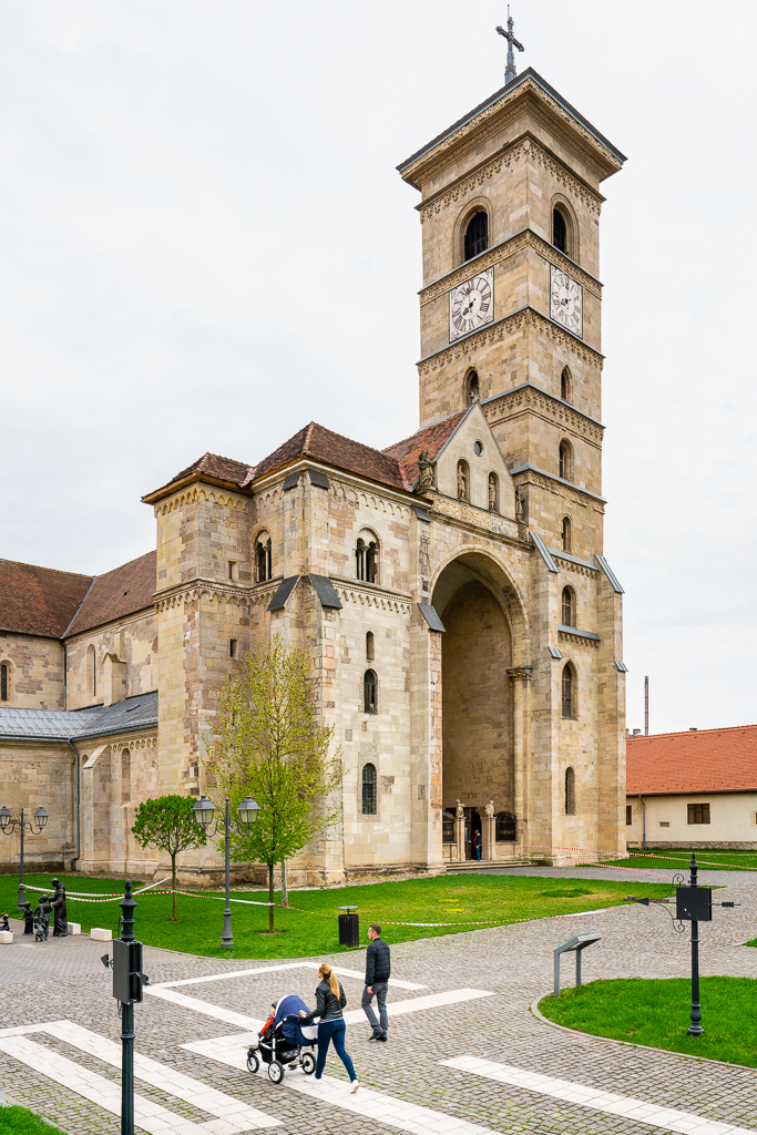 a photo of a family taking an Evening Stroll Past St. Michael's Cathedral in Alba Iulia Romania