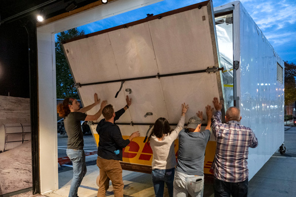 With the Peregrine lunar lander now secured inside the trailer, the Astrobotic employees raise the loading ramp before Peregrine begins its road trip to Florida...on October 27, 2023.