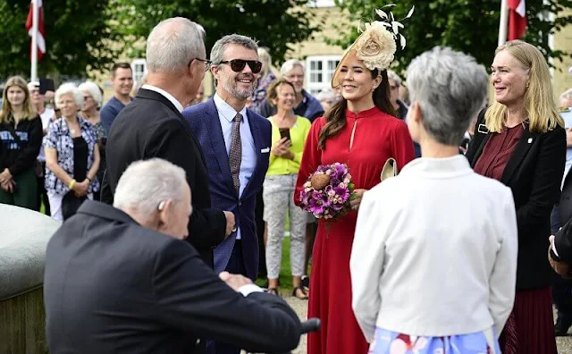 Crown Princess Mary wore a red Armonia silk georgette dress by Raquel Diniz. Crown Prince Frederik