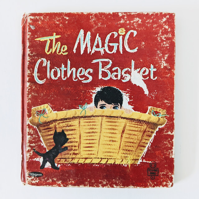 image of children's book cover with boy and cat and laundry basket