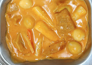 Korean rice cakes in a spicy, sweet, and creamy sauce