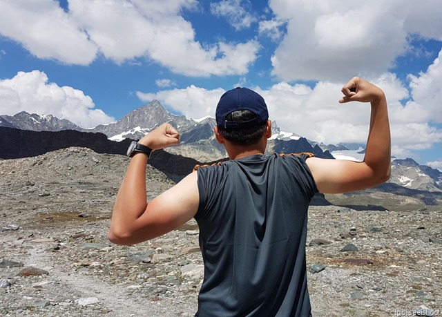 Showing off the effects of the sun on his arms after a few days of hiking.