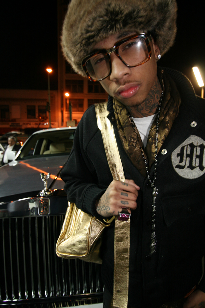  photograph of Tyga I mean he looks dope The glasses the hat tattoos 