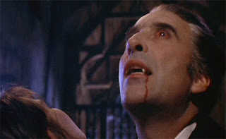 Dracula (Christopher Lee) scores his first victim in Dracula A.D. 1972