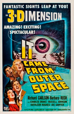 Promotion poster for the 1953 movie, "It Came from Outer Space", depicting a giant alien eye on a movie theater screen.