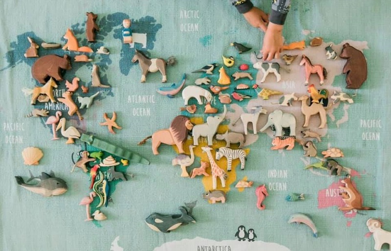 ostheimer wooden toys on a world map