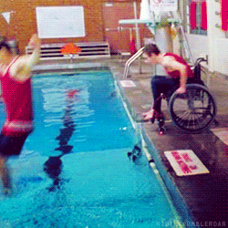 Artie rolls himself and his wheelchair into the pool