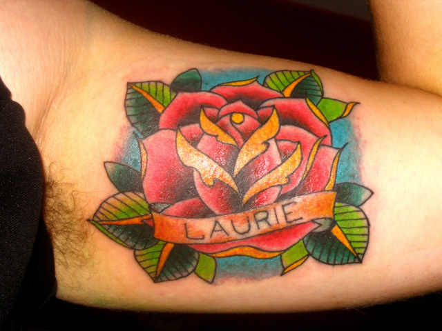 roses tattoo. rose tattoos on side. lower