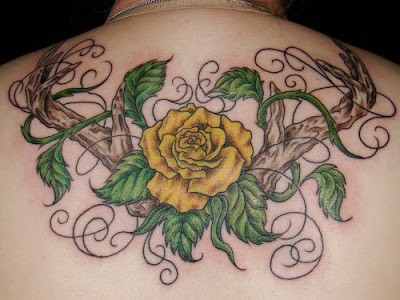 Yellow Rose and Branch Hands tattoo