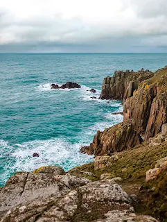 The rocky cliffs at Land´s End in Cornwall, UK, with the rough seas breaking on the rocks.