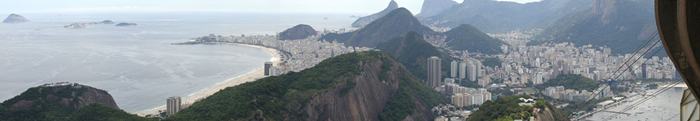 Sugarloaf Mountain, is a peak situated in Rio de Janeiro, Brazil, at the mouth of Guanabara Bay on a peninsula that sticks out into the Atlantic Ocean. Rising 396 metres (1,299 ft) above the harbor, its name is said to refer to its resemblance to the traditional shape of concentrated refined loaf sugar.