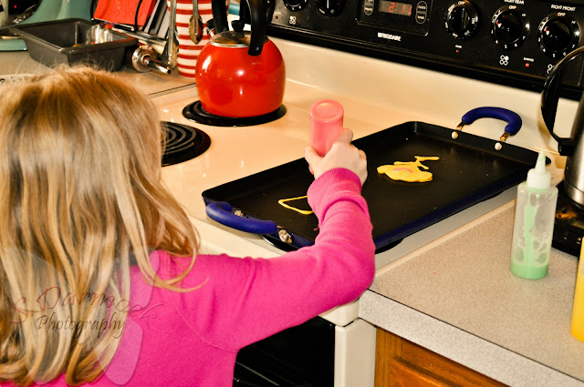 http://www.apocketfullofbuttons.com/2011/12/pancake-fun.html