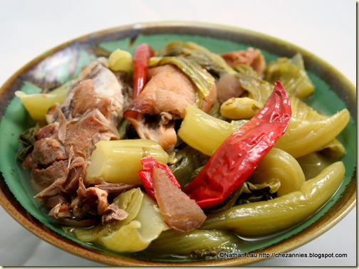 Hot Sour Gai Choy Soup with Roasted Pig's Feet and Duck Heads