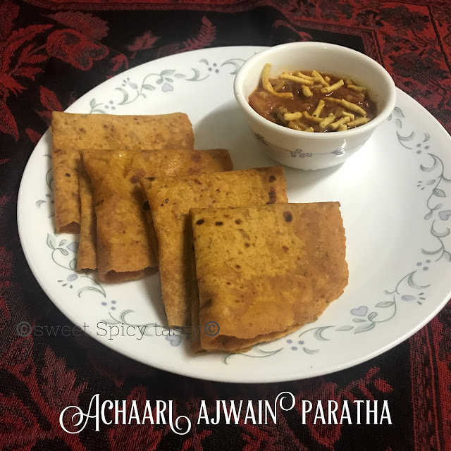 achaari ajwain paratha, paratha , indian flat bread, pickled flat bread , pickle flavored flat bread, achari paratha, ajwain parantha, achari parantha, picnic meal, lunch box , jain parantha, jain paratha, no onion no garlic paratha