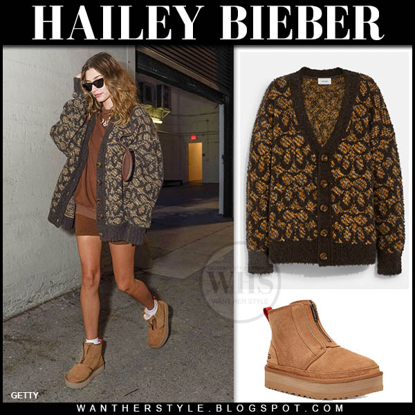 Hailey Bieber in brown cardigan, brown shorts and brown suede ankle boots