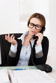 Disengaged businesswoman speaking on phone