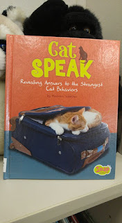 A book titled "Cat Speak"